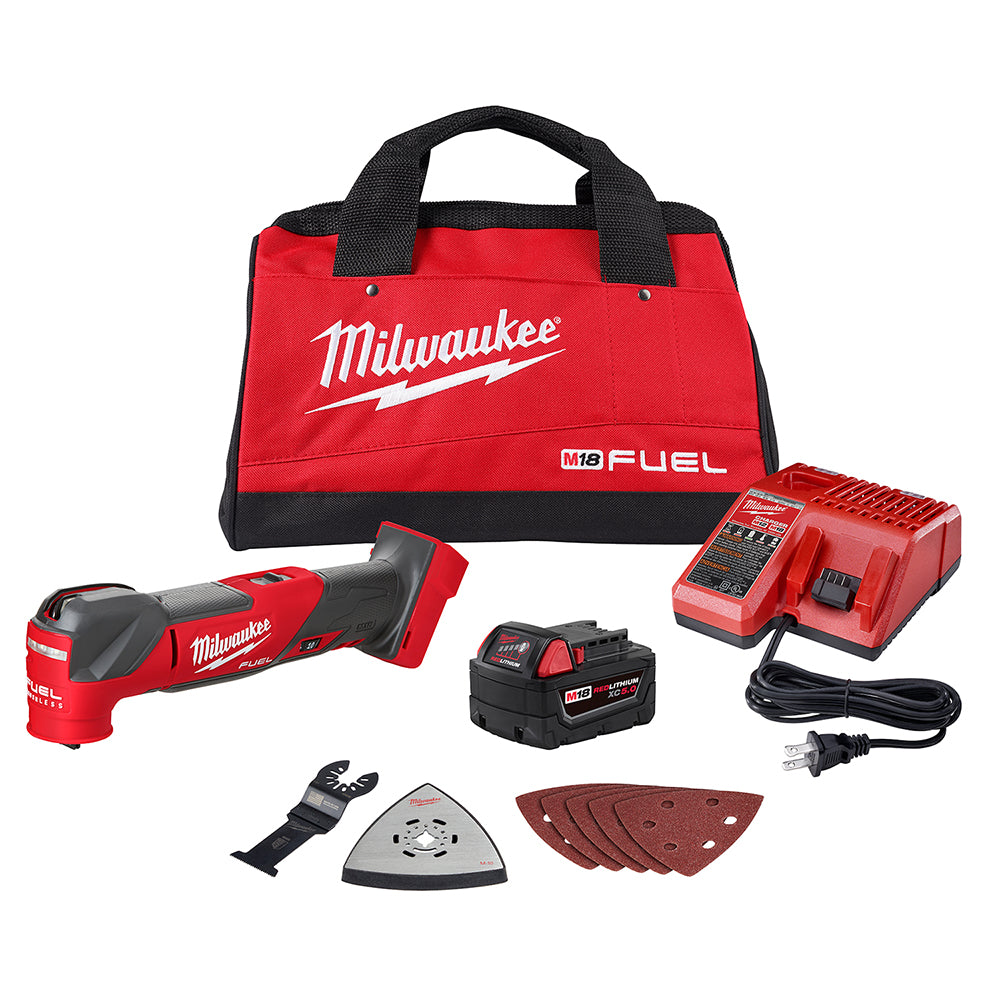 Milwaukee M18 FUEL oscillating multi-tool kit with red canvas bag, charger, battery, accessories, and sanding pads.