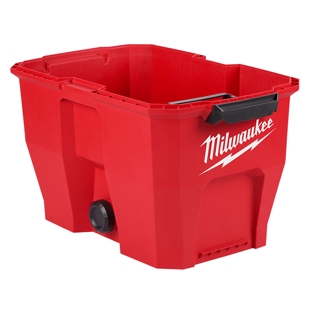Red plastic vacuum tank with Milwaukee logo, black handle, and drain valve on bottom.