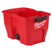 Red plastic vacuum tank with Milwaukee logo, black handle, and drain valve on bottom.