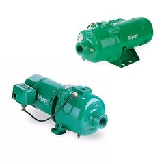 Green cast iron jet pump with motor housing, inlet and outlet ports, mounted on base.