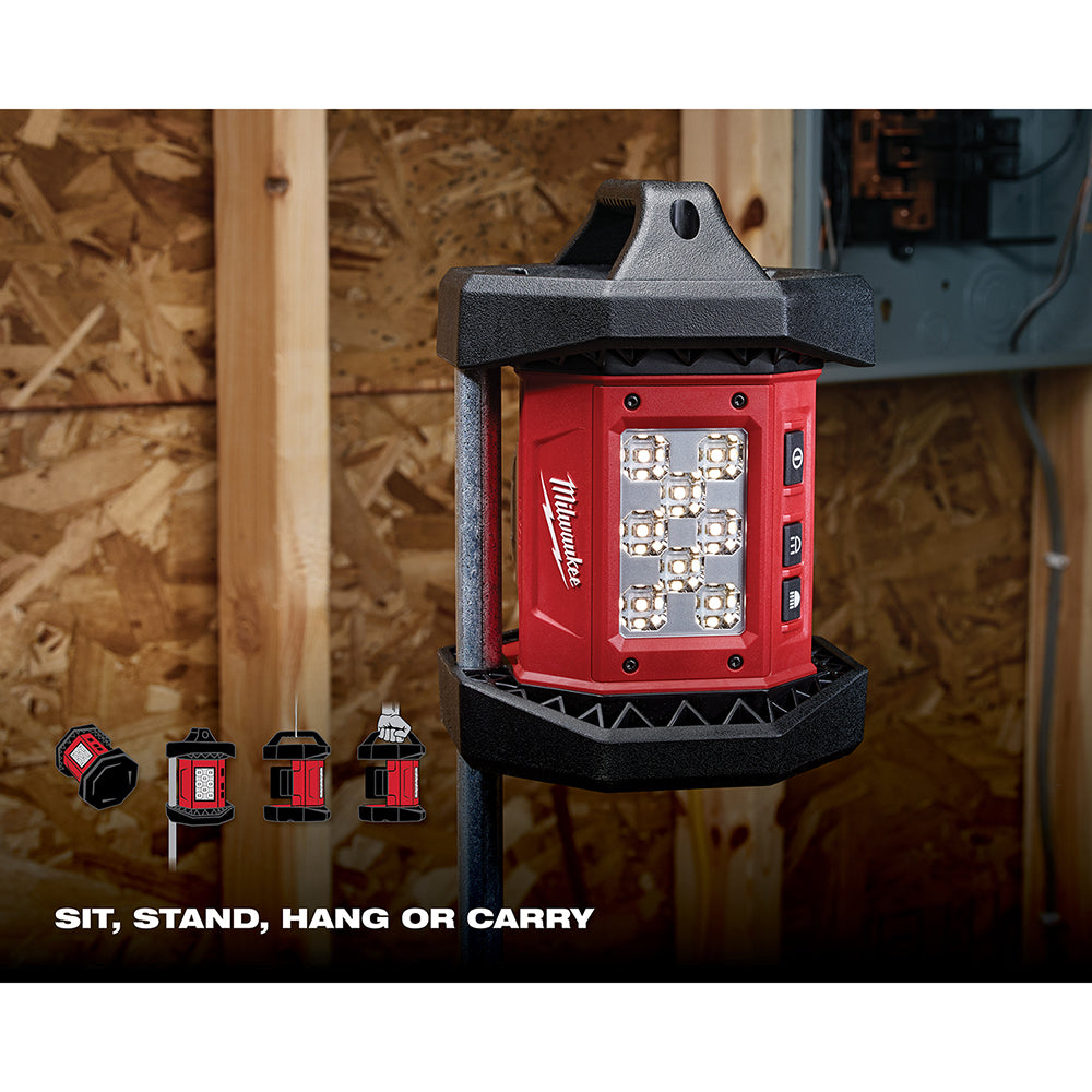 Red and black Milwaukee LED flood light with multiple mounting options displayed, including handheld, stand, and hanging conf