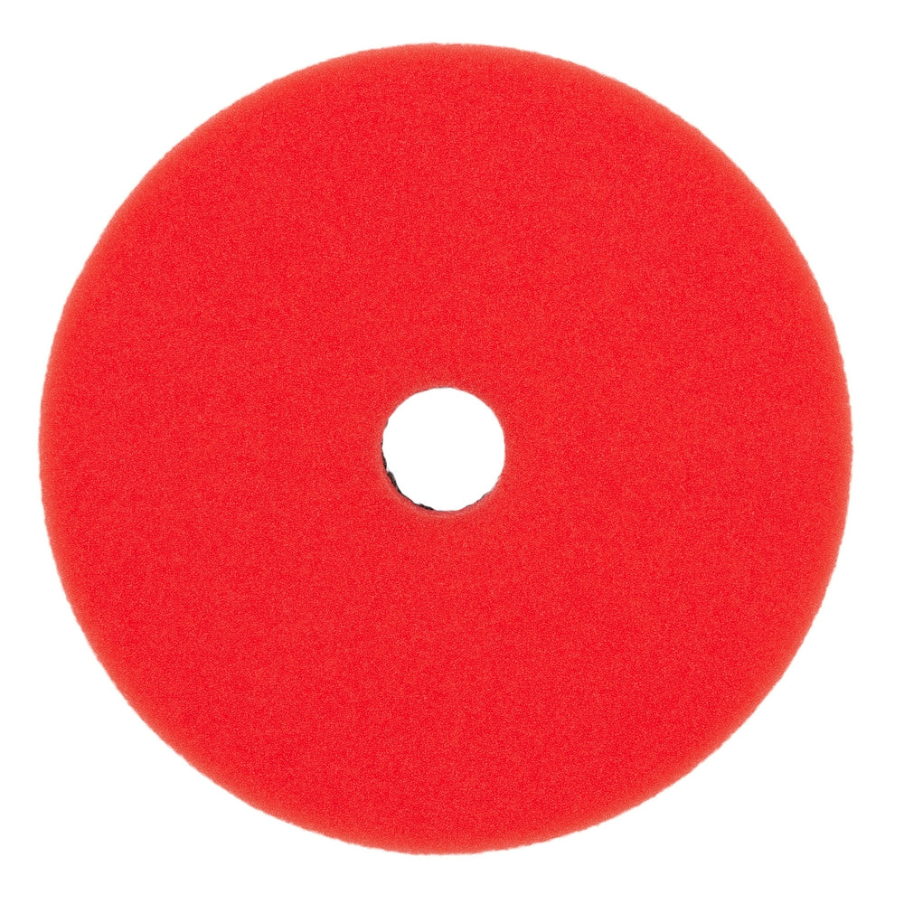 Red foam polishing pad with center hole for tool attachment.