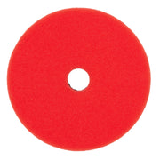 Red foam polishing pad with center hole for tool attachment.
