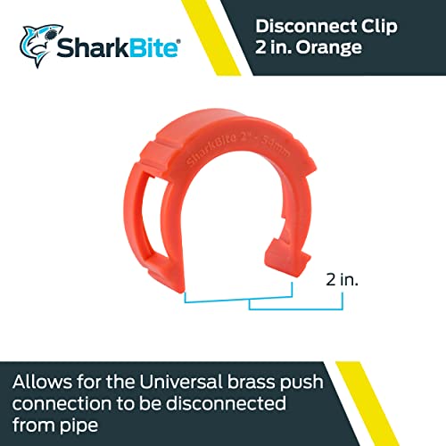Red plastic disconnect clip tool for 2 inch push-to-connect fittings.