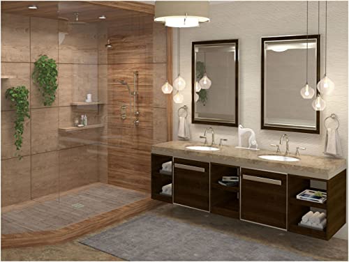Polished chrome widespread lavatory faucet with curved C-spout and dual handles on bathroom vanity.