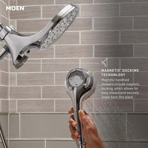 Chrome hand shower with six spray functions and magnetic docking technology mounted on gray tile wall.