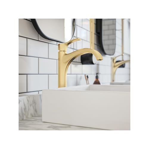 Brushed gold single-hole bathroom faucet with curved spout installed on white vessel sink.