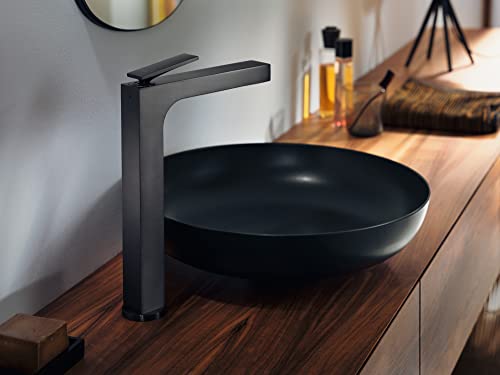 Brushed black chrome single-hole faucet with angular handle mounted above black oval vessel sink on wooden countertop.