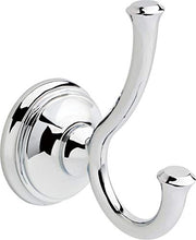 Chrome double robe hook with curved arms and circular wall mounting plate.