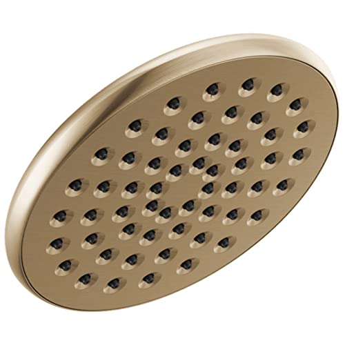 Round brushed gold showerhead with multiple spray holes arranged in a grid pattern.