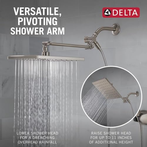 Brushed nickel shower system with adjustable overhead raincan head and handheld spray on pivoting arm.