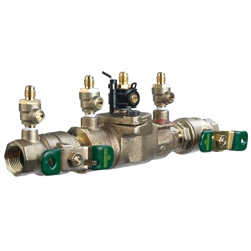 Bronze backflow preventer assembly with multiple brass valve ports, green shutoff handles, and black lever control on center 