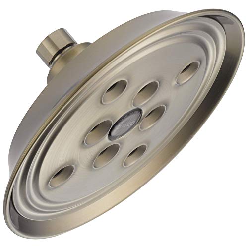 Round brushed nickel shower head with multiple spray jets and wall mount connector.