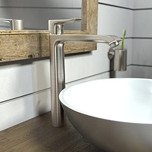 Brushed nickel single-hole faucet with tall curved spout installed above white vessel sink.