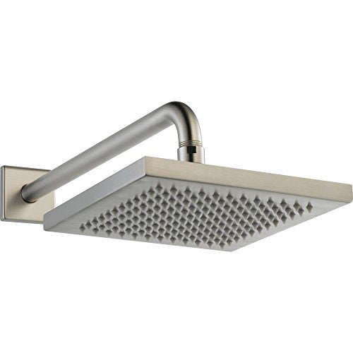 Chrome metal raincan shower head with angled arm mounted on square brushed nickel wall plate.