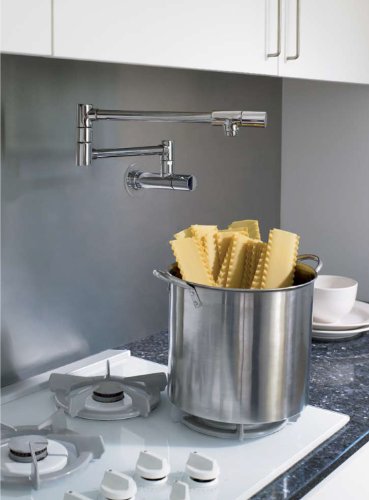 Chrome wall-mounted pot filler faucet with articulating arm extended over stainless steel pot on kitchen counter.