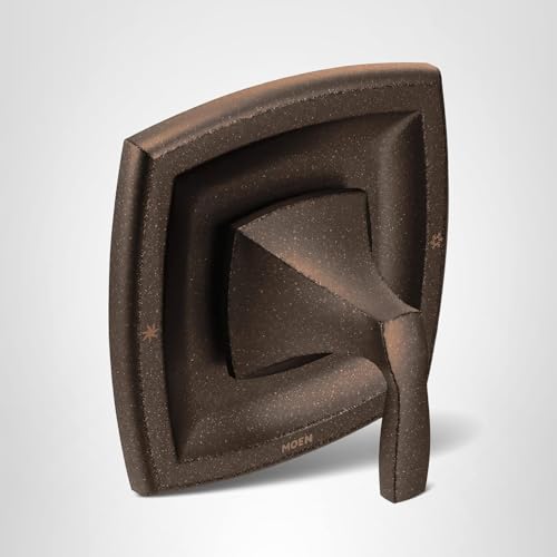 Bronze single-handle pressure balancing valve trim with angular geometric design and Moen branding.