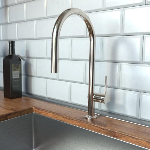 Polished nickel high-arc kitchen faucet with pull-down spray head mounted on wooden countertop.