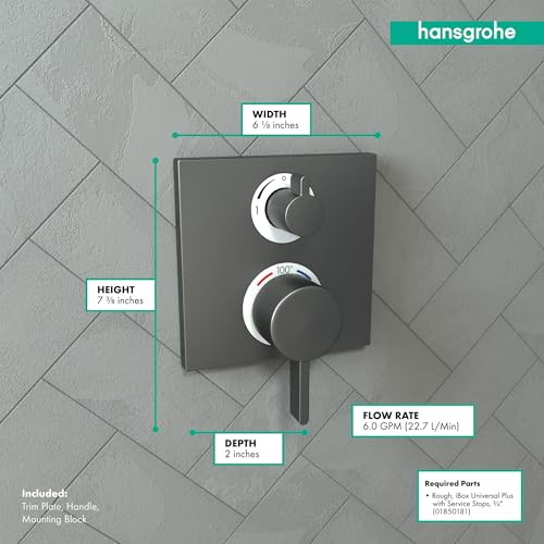 Brushed black chrome square thermostatic shower trim with two circular control knobs mounted on tile wall.