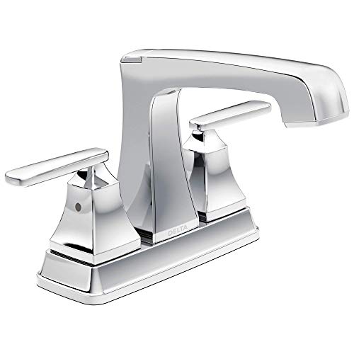 Chrome two-handle centerset bathroom faucet with curved spout and rectangular handles on white base.