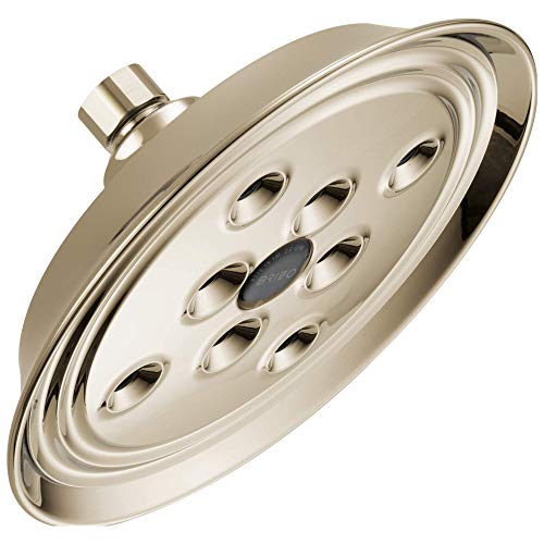 Round polished nickel showerhead with multiple spray jets and wall mount arm connection.