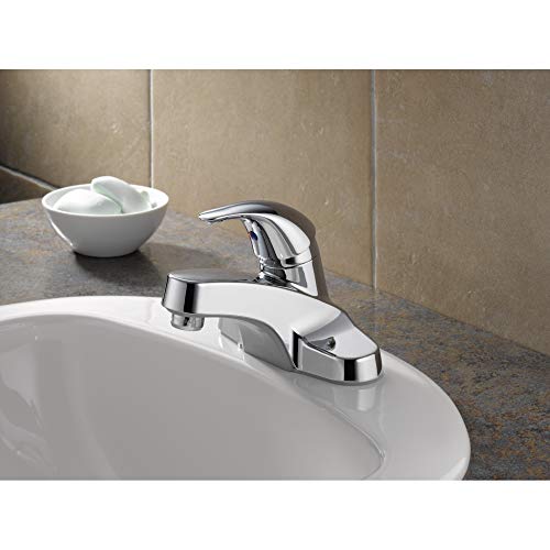 Chrome single-handle bathroom faucet with curved spout installed on white sink.
