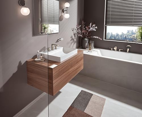 Brushed nickel widespread bathroom faucet with white square sink basin on wooden vanity counter.