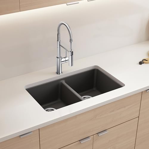 Cinder-colored double basin undermount kitchen sink with low divide and chrome pull-down faucet.
