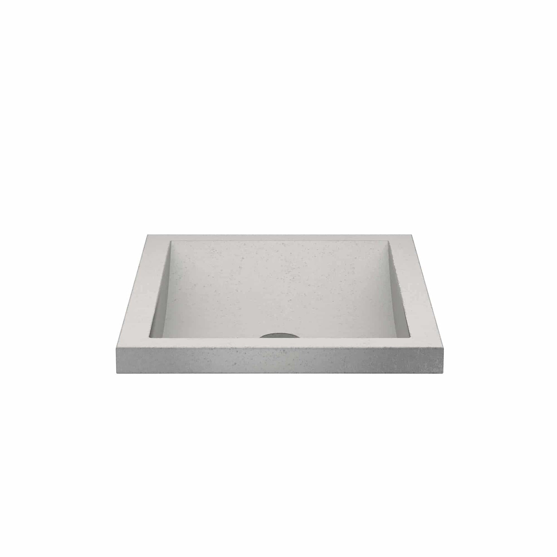 Rectangular ash-colored concrete sink basin with sloped sides and single drain hole.