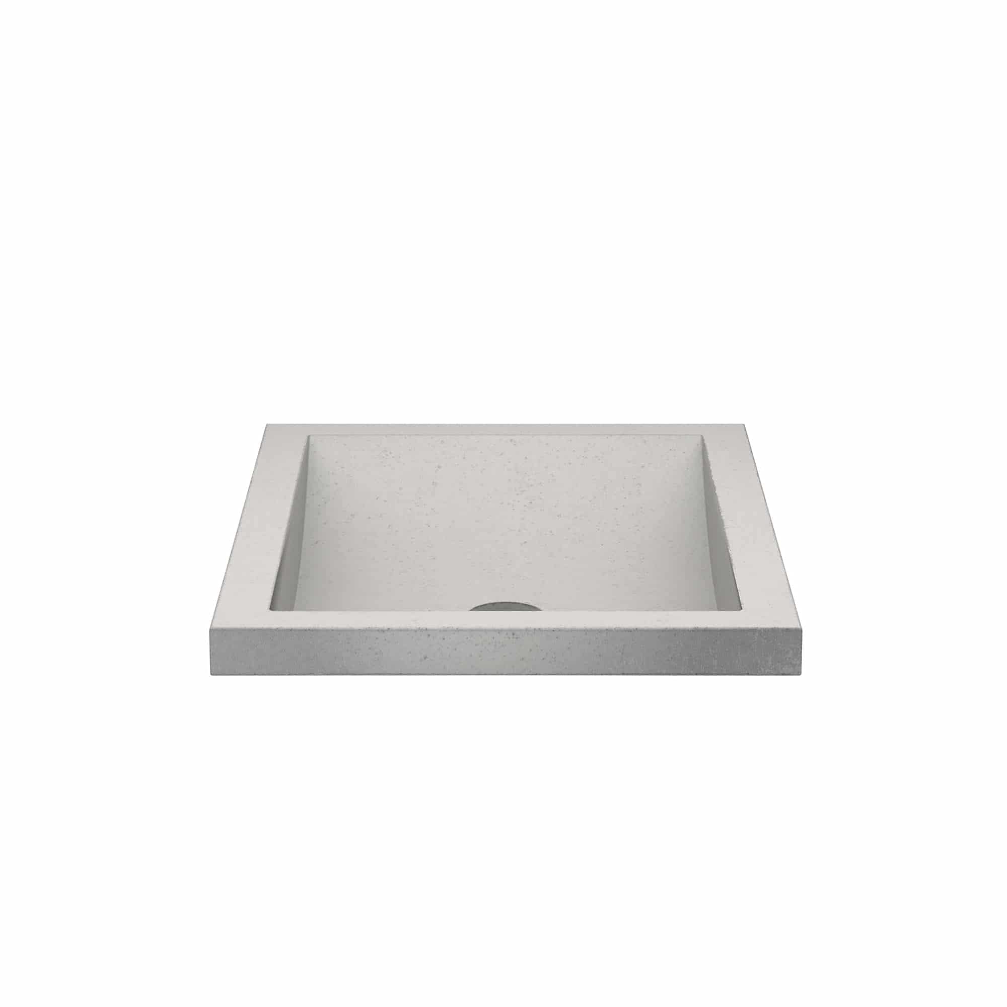Rectangular ash-colored concrete sink basin with sloped sides and single drain hole.