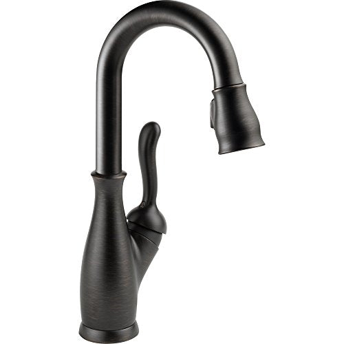 Matte black single-handle pull-down kitchen faucet with curved spout and textured grip handle.