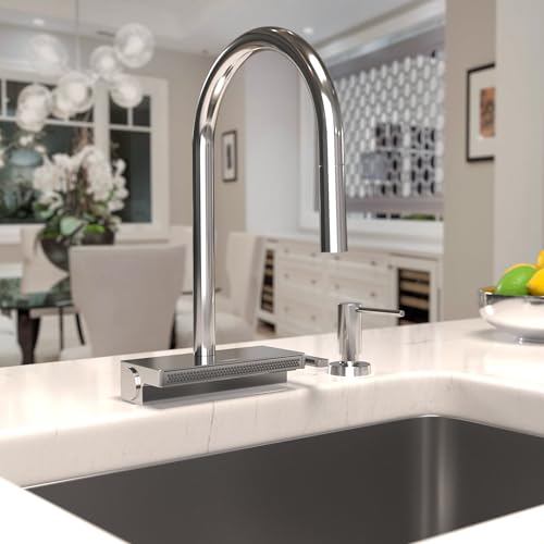 Chrome high-arc kitchen faucet with pull-down spray head mounted on white countertop above stainless steel sink.