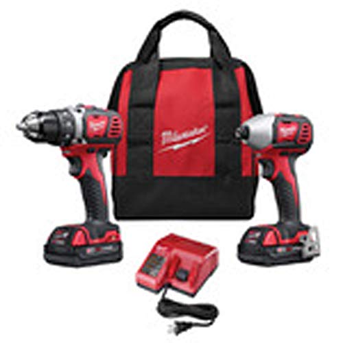 Red and black cordless drill and impact driver with two batteries, charger, and carrying bag.