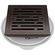 Square shower drain with Venetian bronze grate and slotted pattern design, mounted on white collar base.