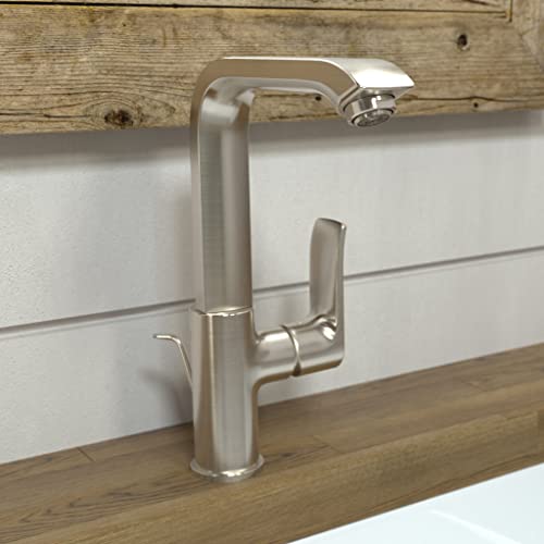 Brushed nickel single-hole kitchen faucet with tall curved spout and lever handle on white subway tile backsplash.
