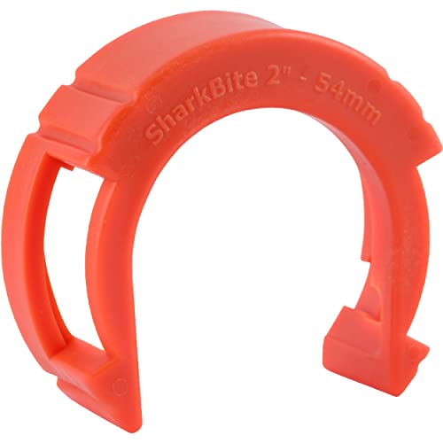 Red plastic disconnect tool with horseshoe shape and grip handles, labeled for 2-inch push-to-connect fittings.