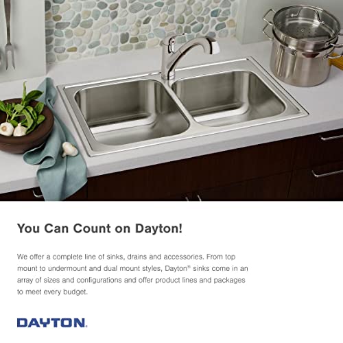 Stainless steel double bowl undermount sink installed in white countertop with faucet and accessories.
