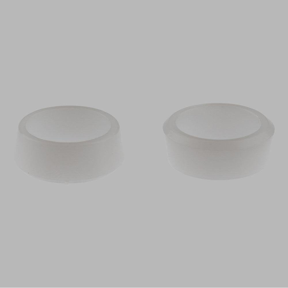 Two translucent plastic cylindrical sleeves with flat tops against a gray background.