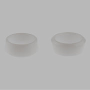 Two translucent plastic cylindrical sleeves with flat tops against a gray background.