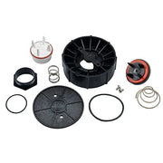 Pressure vacuum breaker repair kit with black plastic components, white and red cartridge, metal springs, and rubber seals ar