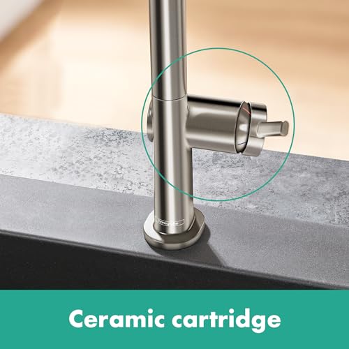Brushed black chrome U-shaped kitchen faucet with single spray handle mounted on countertop, ceramic cartridge visible in cir