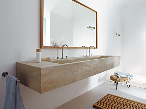 Brushed nickel widespread faucet with two handles mounted on a concrete wall-mounted sink in a modern bathroom.