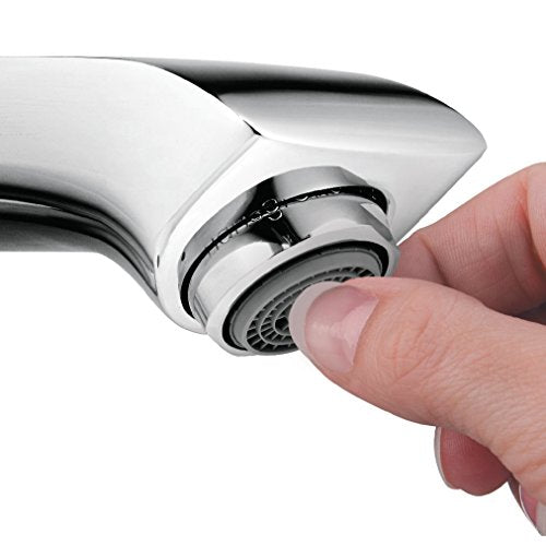 Chrome widespread faucet with curved spout and aerator being adjusted by hand.