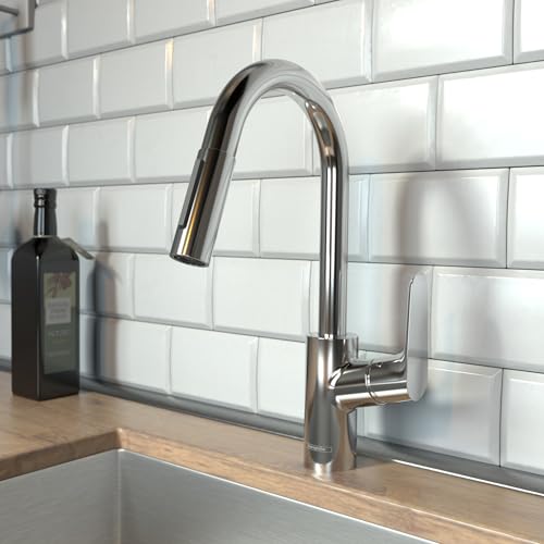 Chrome pull-down kitchen faucet with curved spout mounted on white subway tile backsplash.