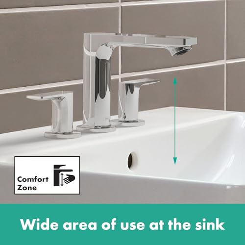Matte black widespread bathroom faucet with pop-up drain and two side handles on white sink.