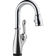 Polished chrome single-handle pull-down kitchen faucet with curved spout and touch-activated control lever.