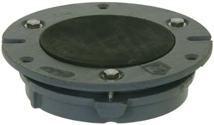 Cast iron toilet flange with black test cap and mounting holes on gray circular base.
