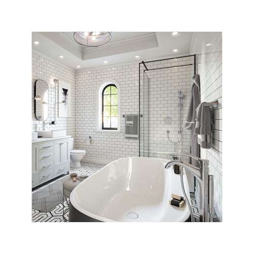 Polished nickel single-hole bathroom faucet with curved spout installed above white oval soaking tub.