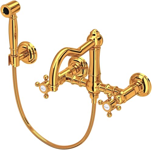 Italian brass wall-mount bridge kitchen faucet with curved spout, sidespray wand, and cross handles.