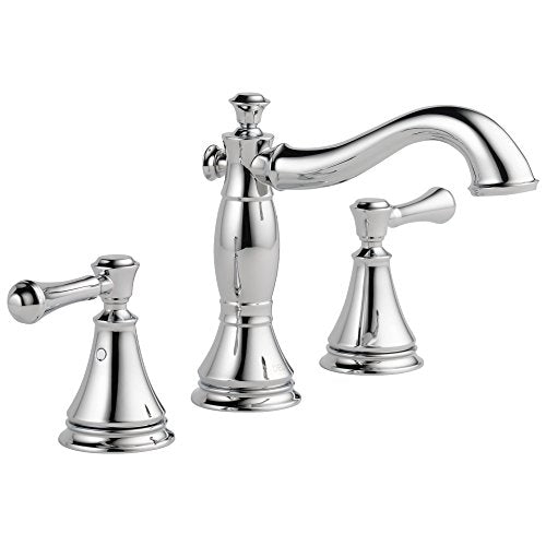 Chrome two-handle widespread bathroom faucet with curved spout and cone-shaped base handles.